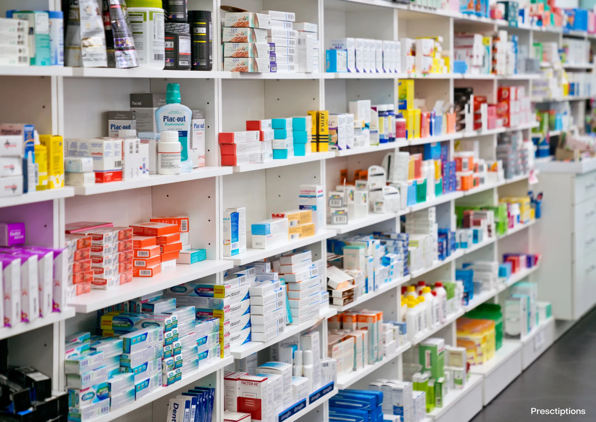 A row of medications in a pharmacy.
