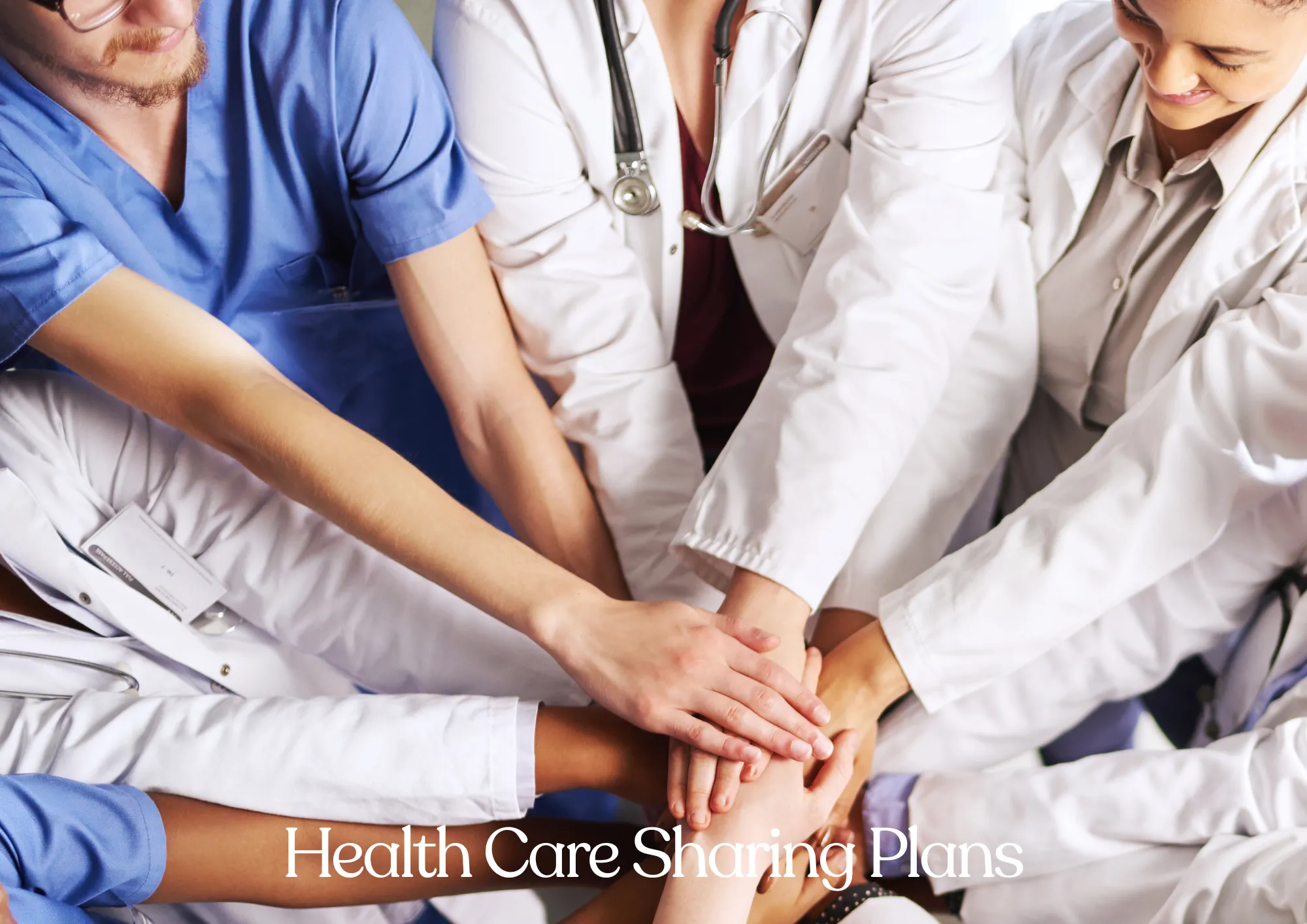 Many hands clasping together